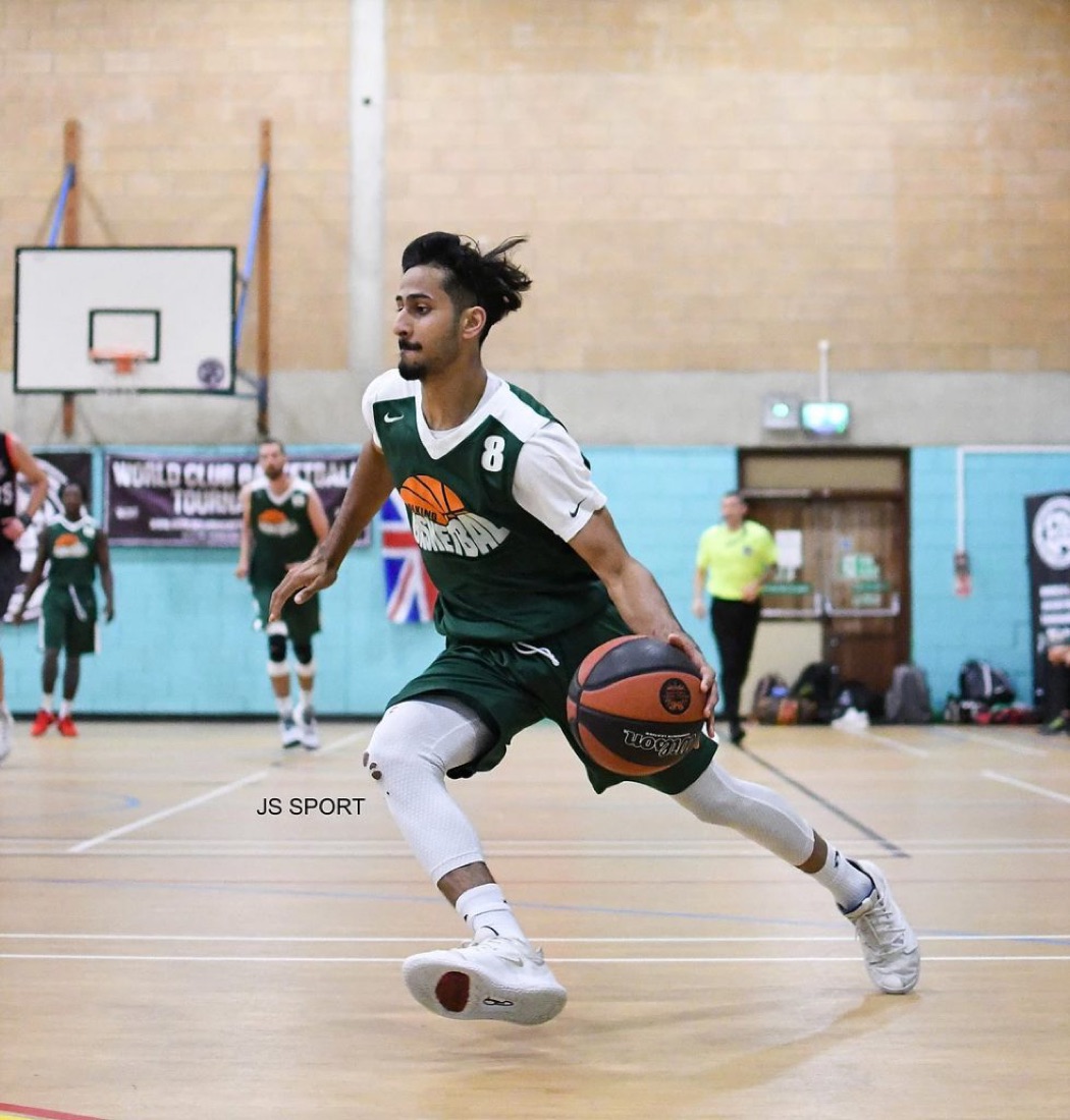 Player driving low with the ball during a game